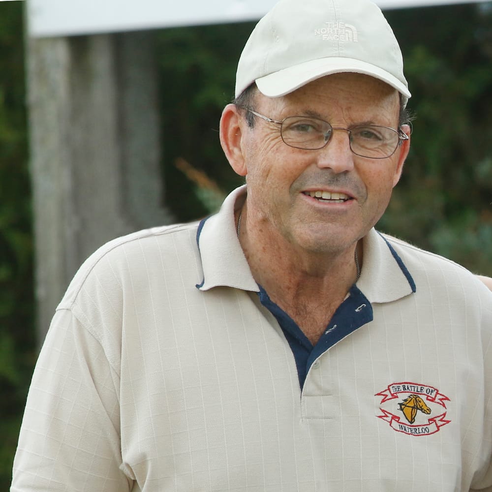 Former raceway manager Ted Clarke passes post image