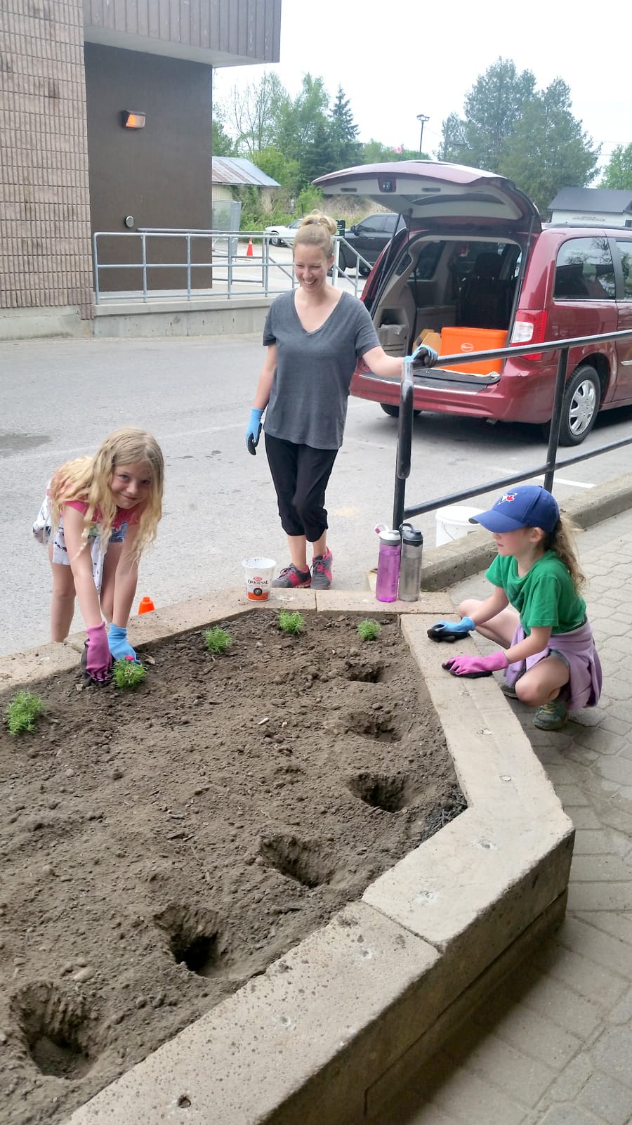 Arthur Junior Horticultural  Society help plant a garden at local post office post image