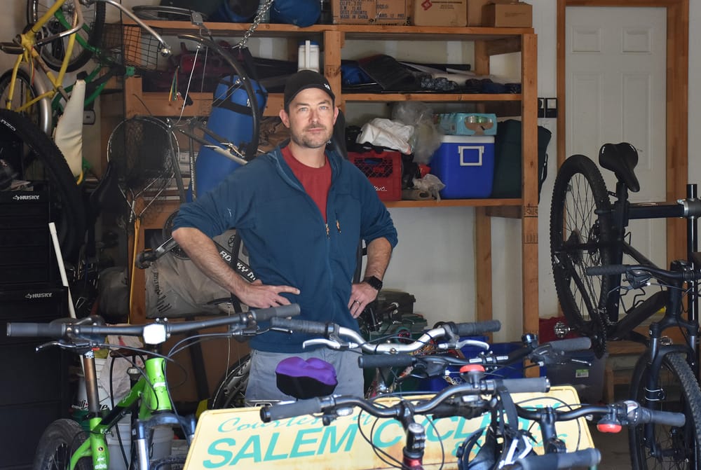 Teacher providing bike repairs in support of Portage Elora post image