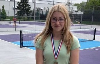 Wellington Heights student wins gold at CWOSSA tennis championships post image