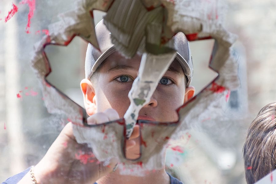 Arthur School of Art teams up with local students to paint village red, white post image