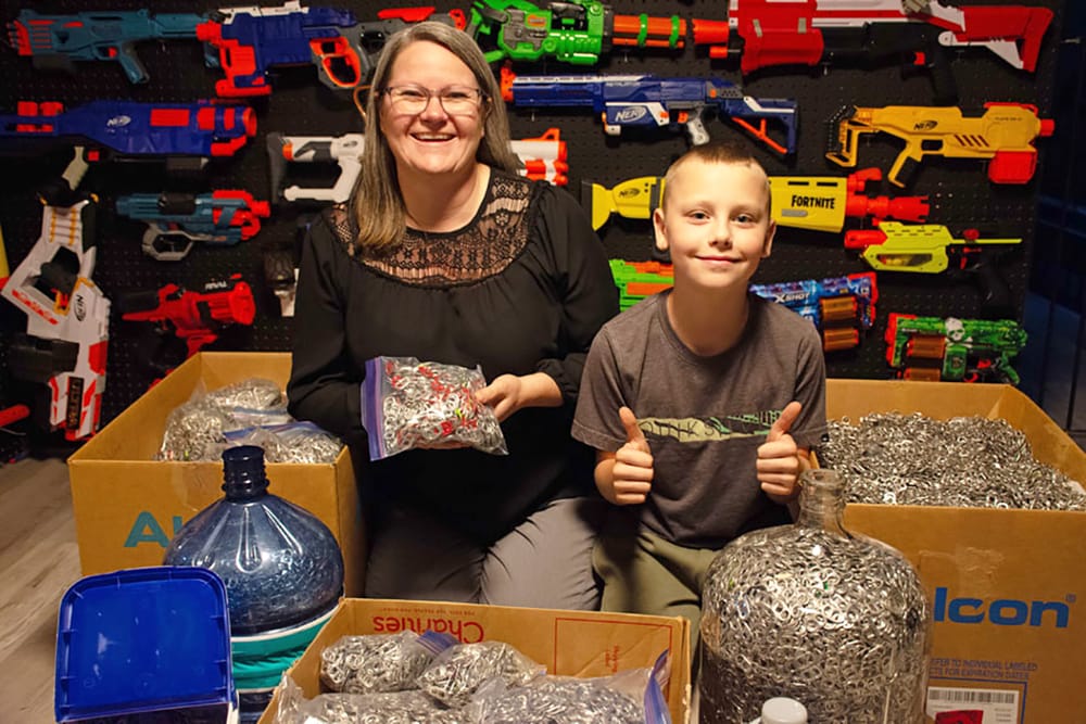 Fergus boy collects 165 pounds of pop can tabs to help little girl get a wheelchair post image