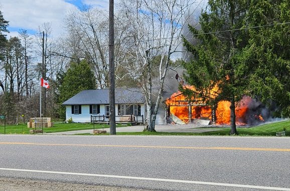 Highway 7 fire destroys garage, damages home post image