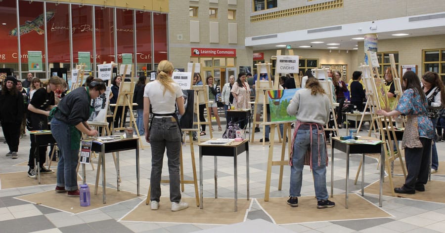 Students raced to paint canvasses during board-wide Live Art Battle post image