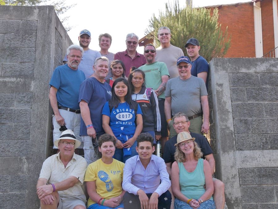 Retired electricians repair wiring in Guatemalan school
