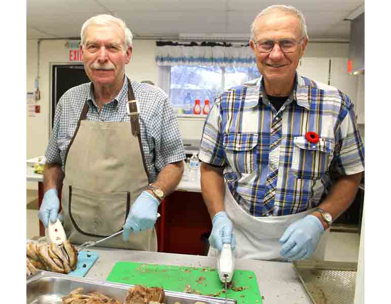 Rotarians serve pork supper