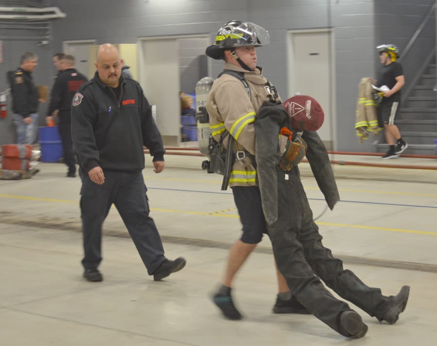 Volunteer firefighter recruits endure physical fitness tests in Hillsburgh