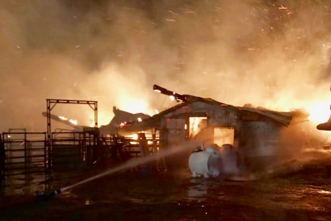 Large fire destroys barn near Alma
