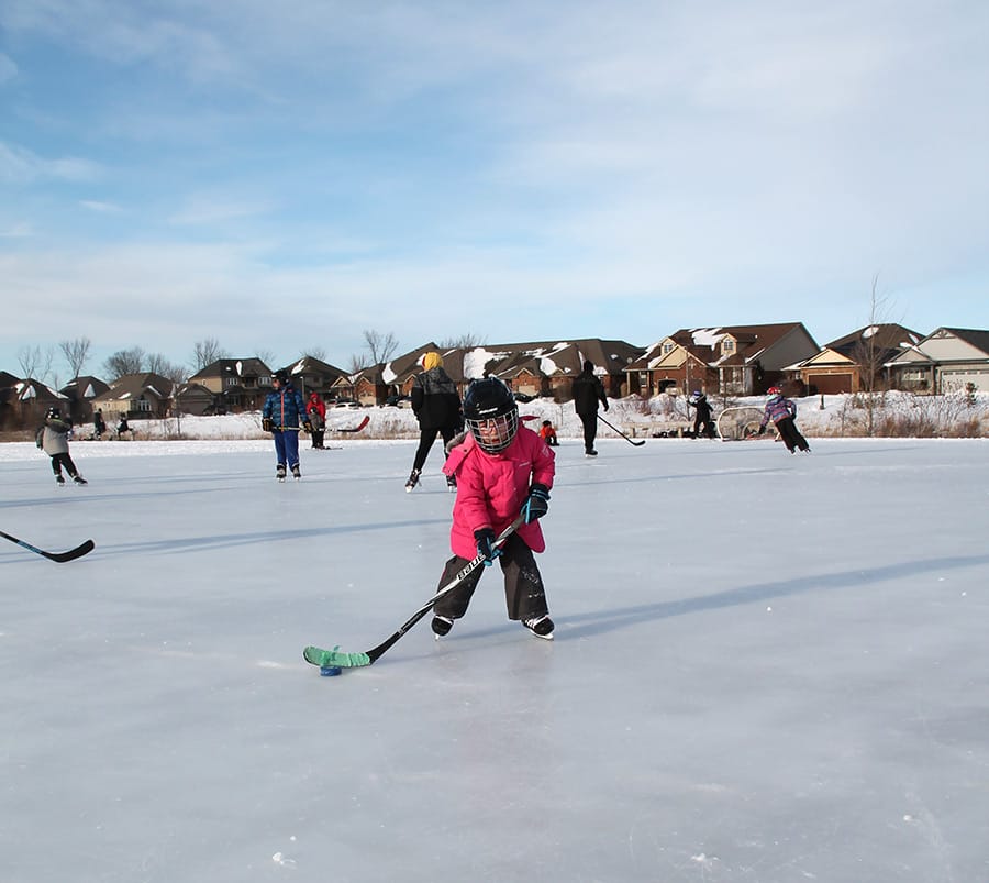 Skaters of all ages enjoying outdoor rink at Southridge Park