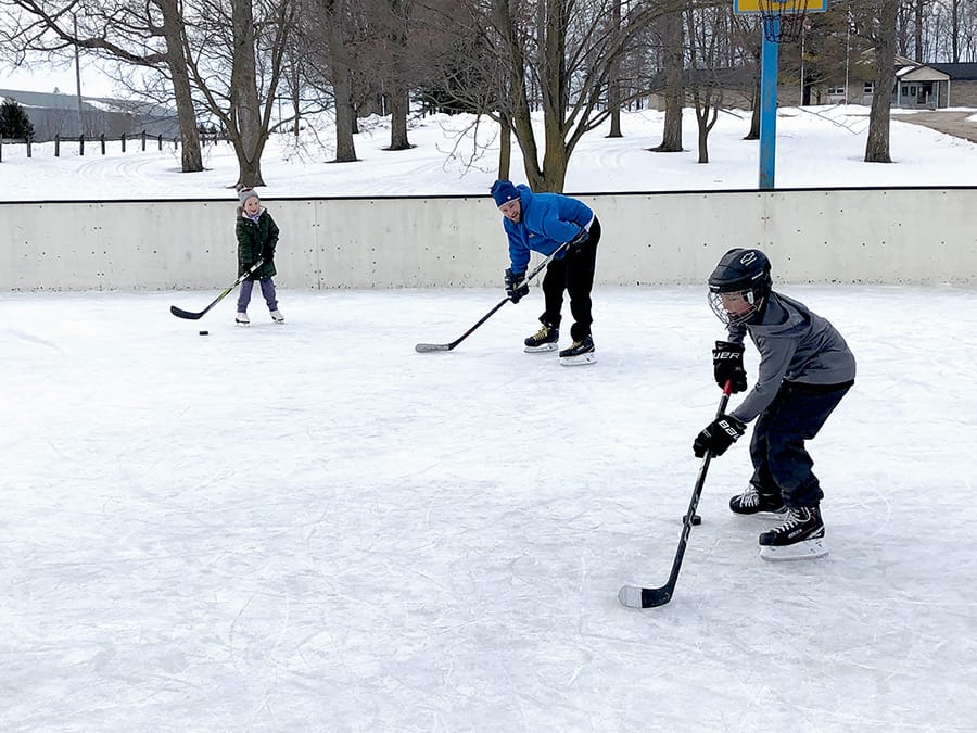 Passing the puck at the Moorefield Optimist Club's outdoor rink