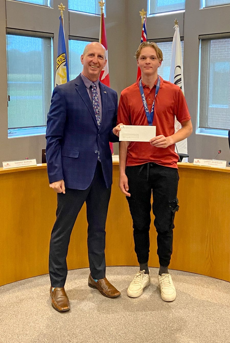Mayor Gregg Davidson presents Township of Mapleton athletic bursary
