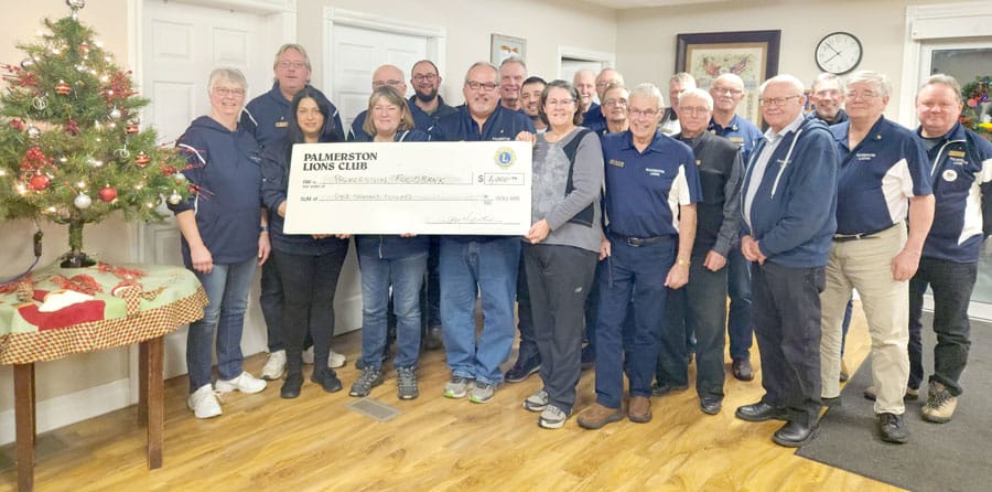 Palmerston Lions Club presents check to Palmerston Food Bank